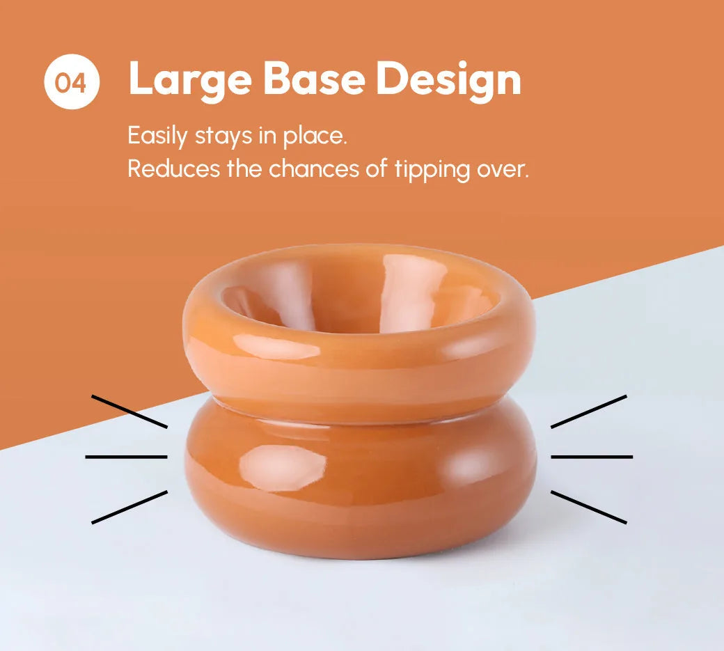 Amber orange pet bowl with a large base design that prevents tipping and ensures stability during mealtime.
