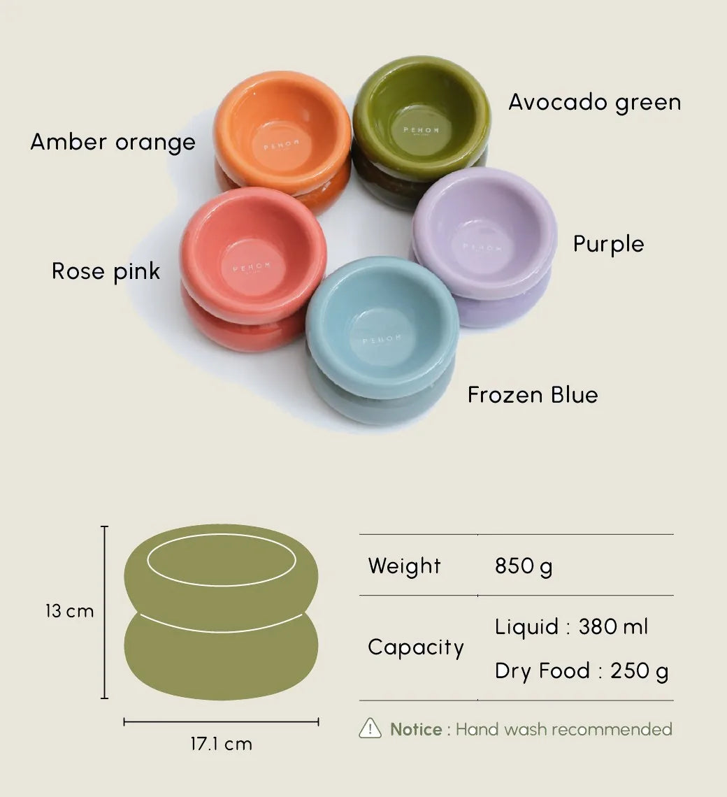 Avocado green pet bowl with diagonal opening and large base, designed for comfortable feeding and easy cleaning.