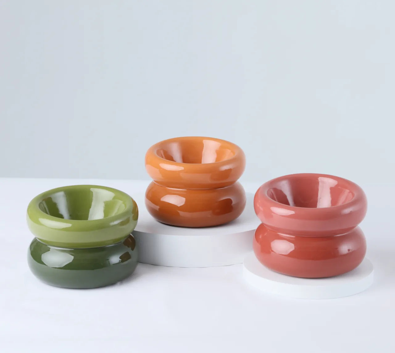 Avocado green pet bowl with a unique diagonal opening design, featuring a smooth, glossy finish.