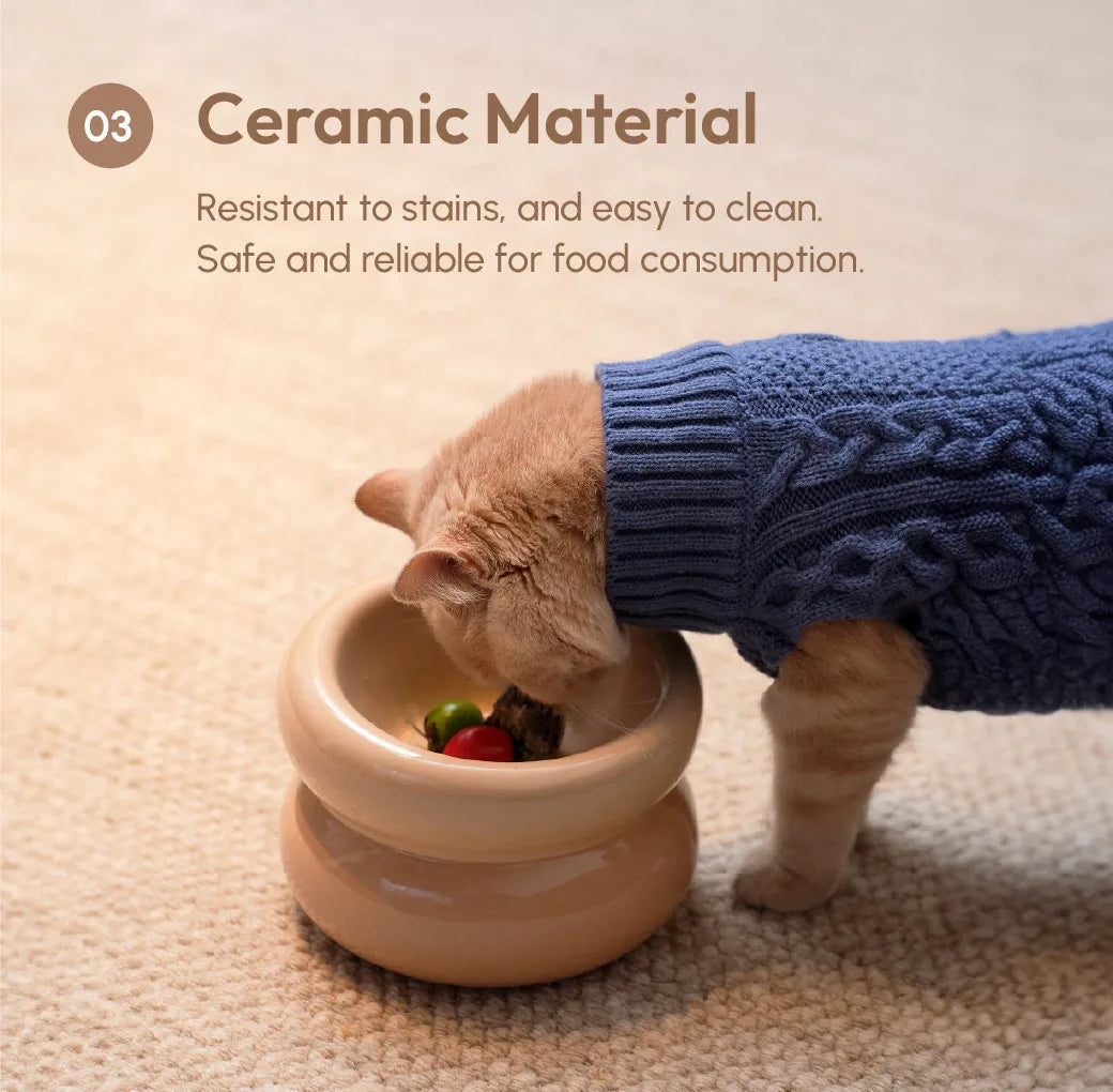 Cream beige ceramic pet bowl with a diagonal opening, designed for comfortable feeding and easy cleaning.