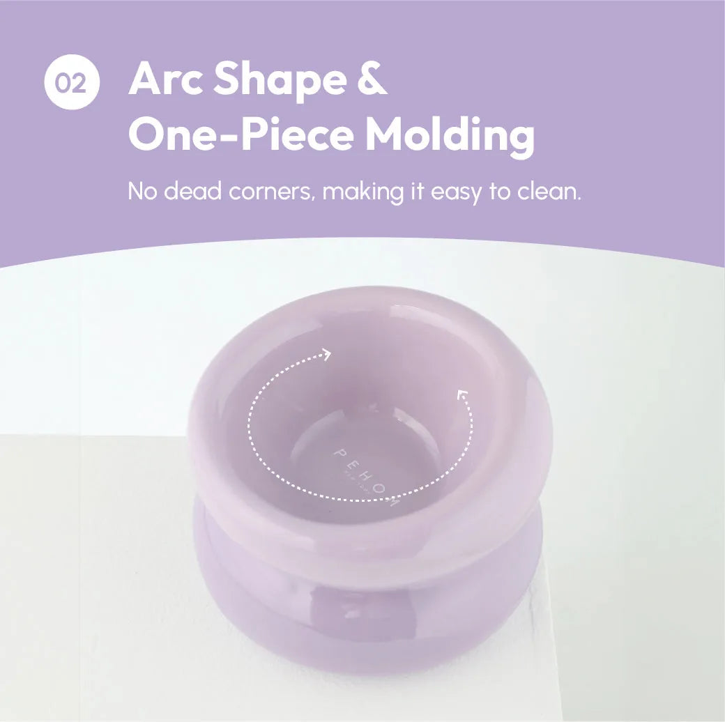 Purple soufflé pet bowl featuring arc shape and one-piece molding for easy cleaning. Ideal for feeding pets comfortably.