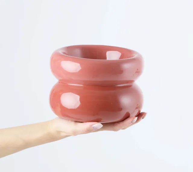Rose pink Soufflé Pet Bowl with a smooth, glossy finish, designed for comfortable feeding and easy cleaning, held in hand.