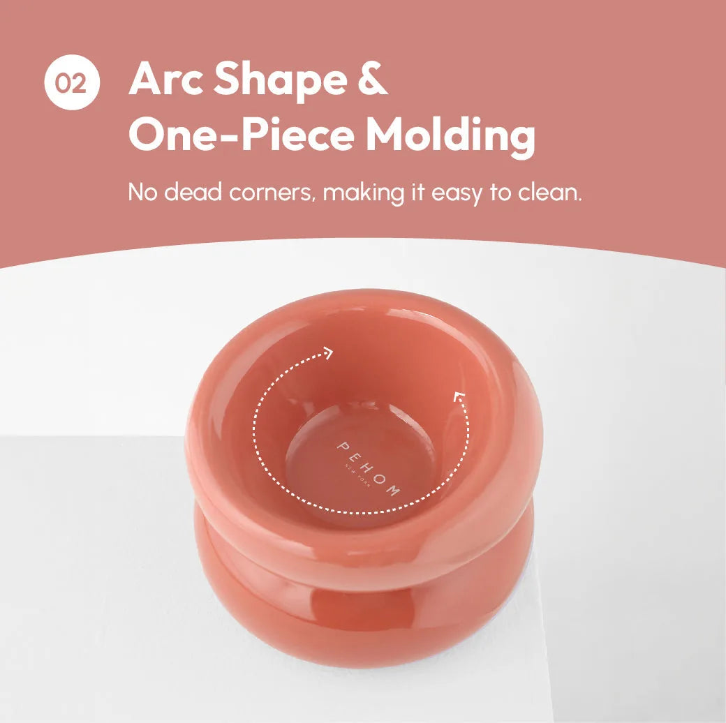 Soufflé pet bowl in rose pink features a smooth arc shape and one-piece design for easy cleaning.
