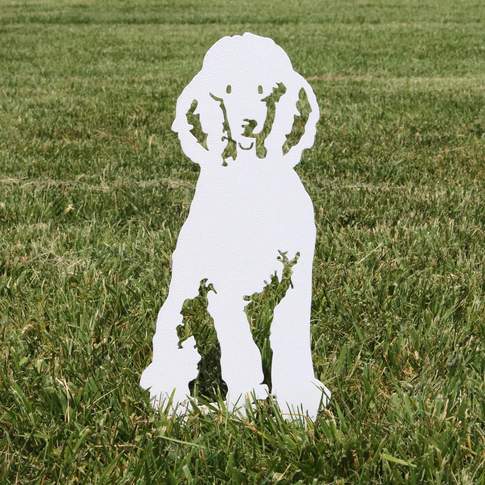 Special Edition white poodle silhouette made from 11 gauge metal, displaying a glossy finish against grassy background.