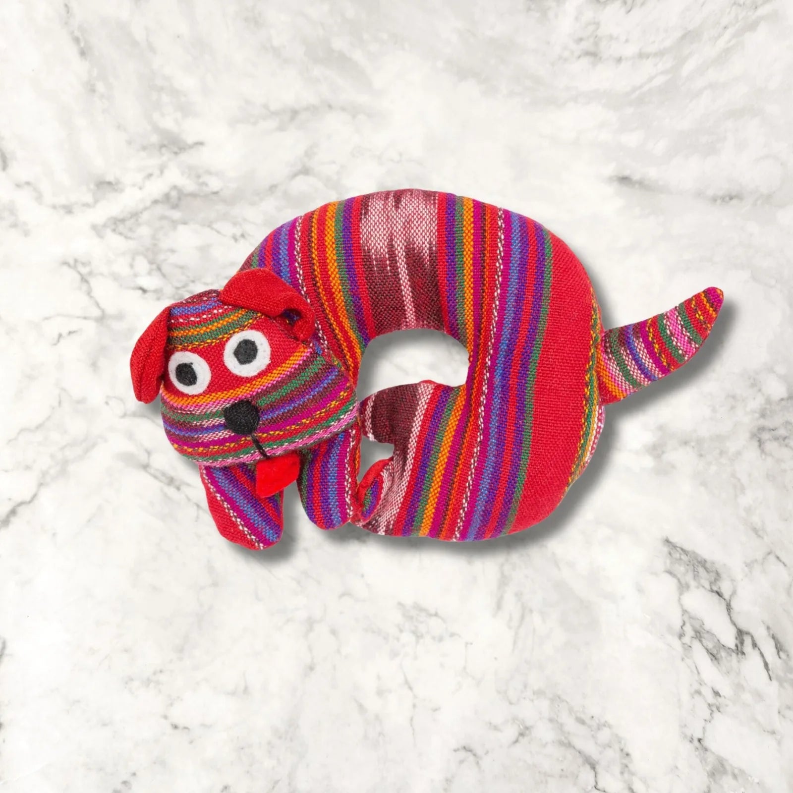 Colorful handmade Spiced Dog Trivet in red and stripes, featuring a playful dog design with a cozy, warm look.