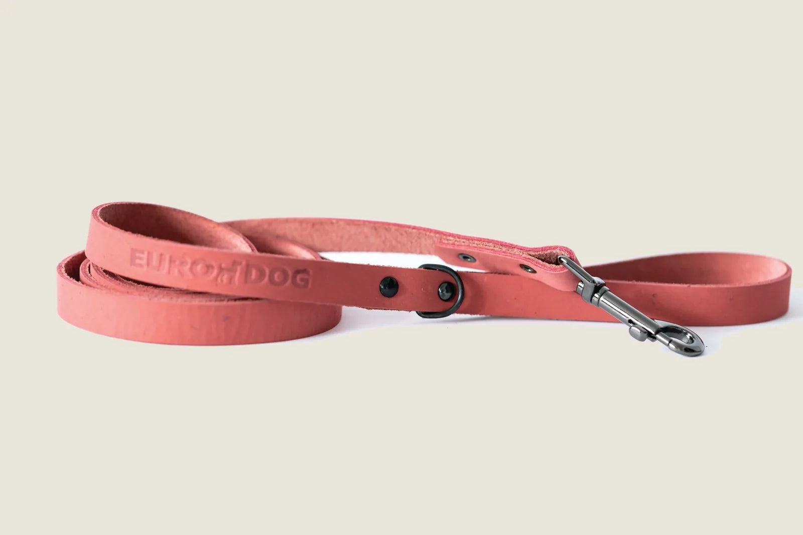 Sporty coral reef leather dog leash featuring black hardware, designed for active walks and durability.