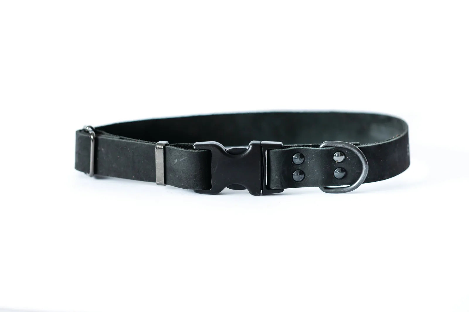 Midnight black leather dog collar with sleek design, featuring a quick-release buckle and all-black hardware.