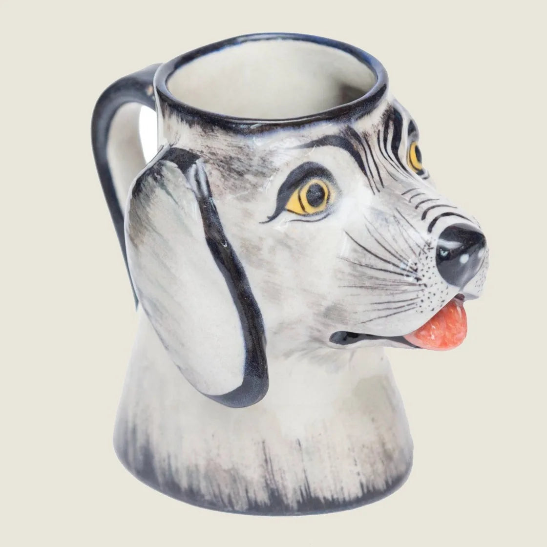 Handmade stoneware dog mug with a 3D face, gray and white accents, and a tapered handle, holding 16 ounces.