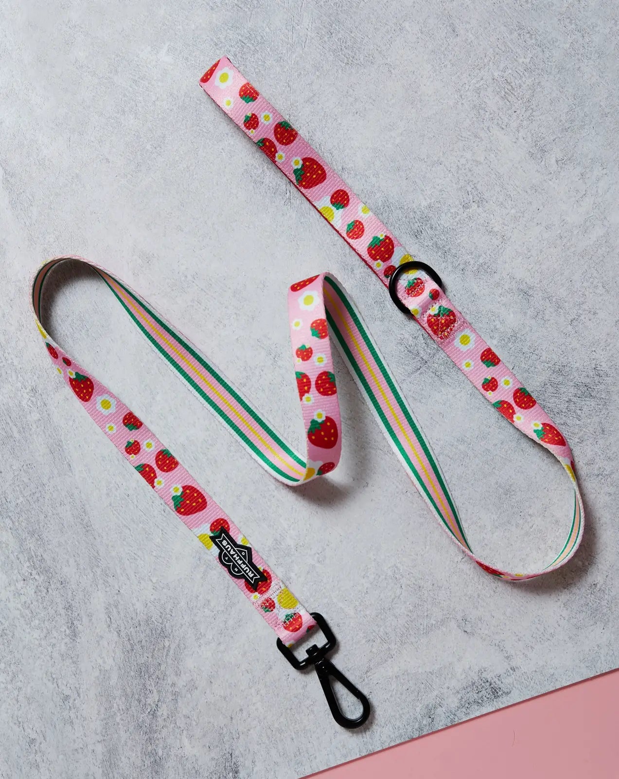 Durable pink dog leash featuring a vibrant strawberry pattern and a neoprene-lined handle for comfort.