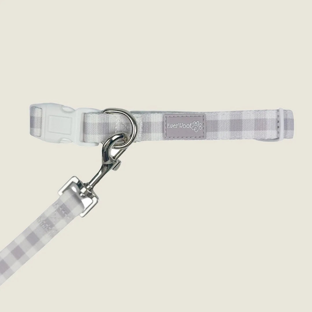Adjustable Sugar Plum collar by EverWoof, featuring a soft gray checkered pattern with a sturdy buckle and leash clip.