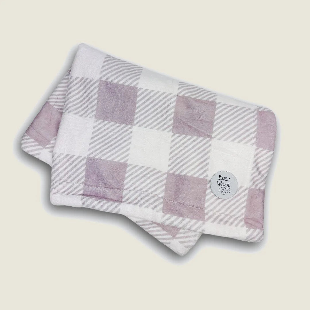 Cozy double-sided Sugar Plum Dog Blanket in soft purple and white checkered pattern, featuring the EverWoof logo.