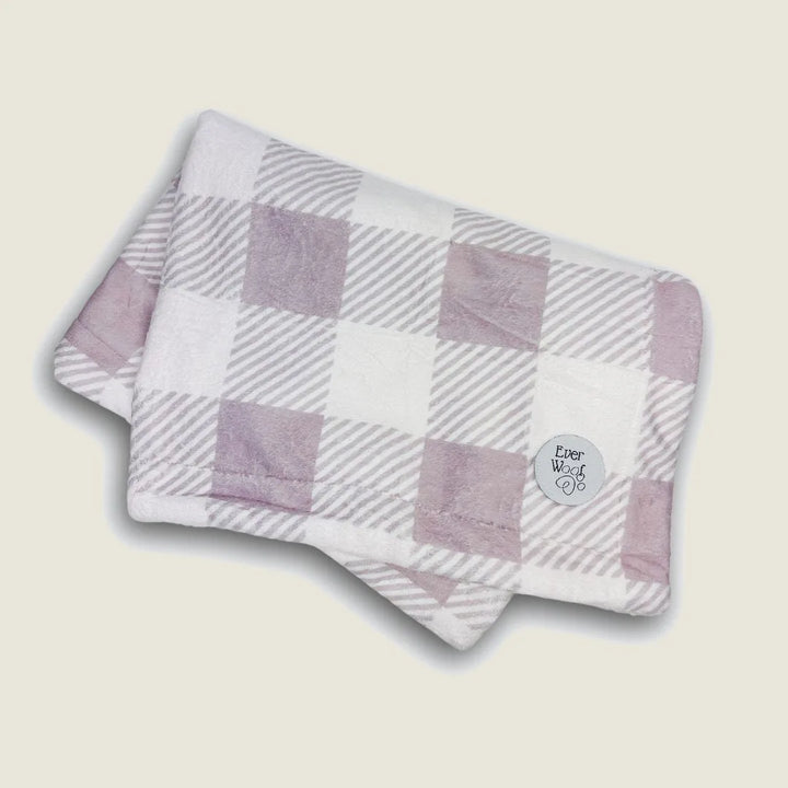 Cozy double-sided Sugar Plum Dog Blanket in soft purple and white checkered pattern, featuring the EverWoof logo.