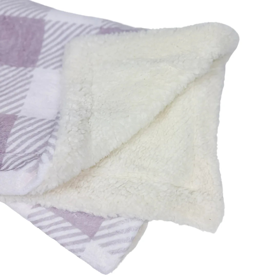 Cozy Sugar Plum dog blanket featuring a soft lavender plaid micro-fiber side and plush cream sherpa reverse.