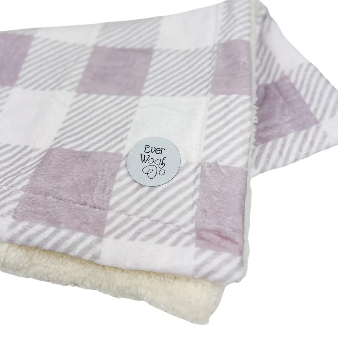 Cozy Sugar Plum Dog Blanket with a soft lavender checkered pattern and plush cream sherpa lining, by EverWoof.