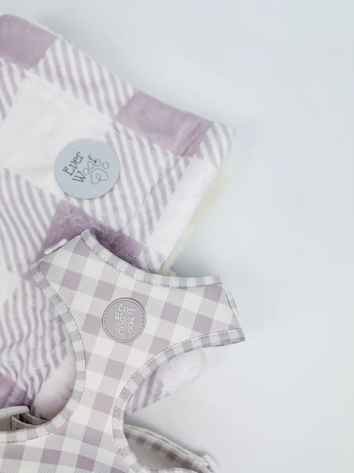 Cozy Sugar Plum Dog Blanket with a lavender and cream checkered pattern, featuring a plush side and EverWoof logo.