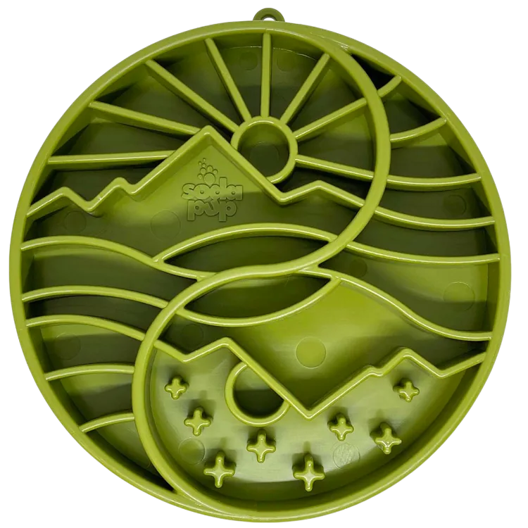 Shallow green slow feeder dog bowl with sun and moon design, featuring raised ridges for mental enrichment.