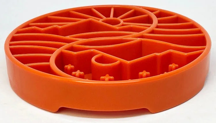 Orange shallow slow feeder dog bowl featuring a sun and moon design with raised ridges for enrichment and mindful eating.