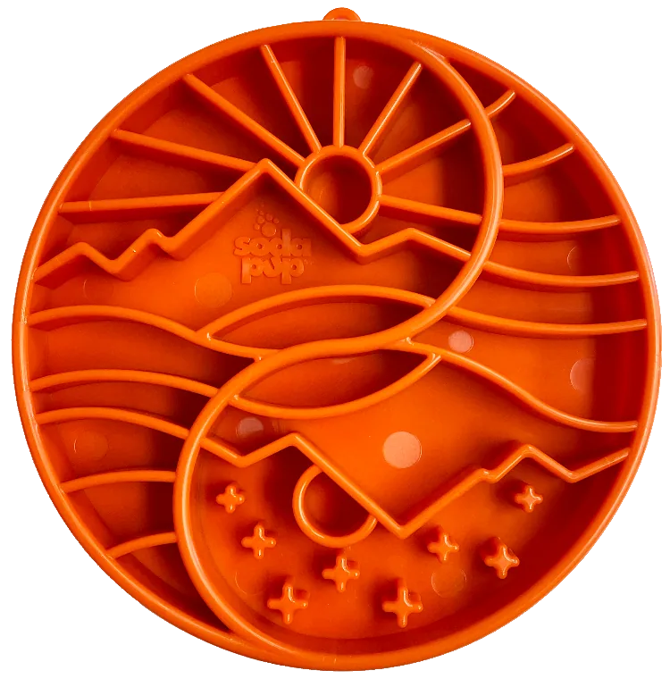 Shallow orange eTray dog bowl with sun and moon design, featuring raised ridges for slow feeding and mental enrichment.