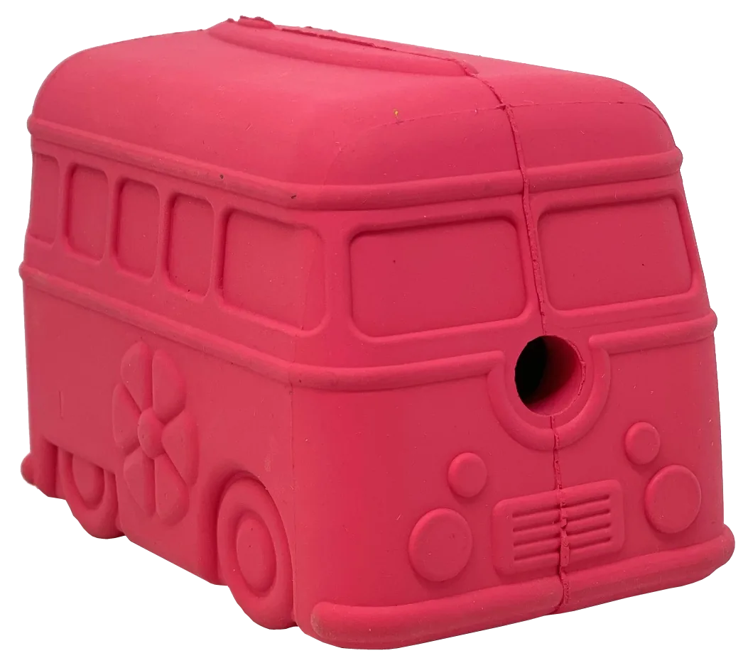 Bright pink retro van chew toy made from durable rubber, featuring a treat dispenser hole and fun flower design.