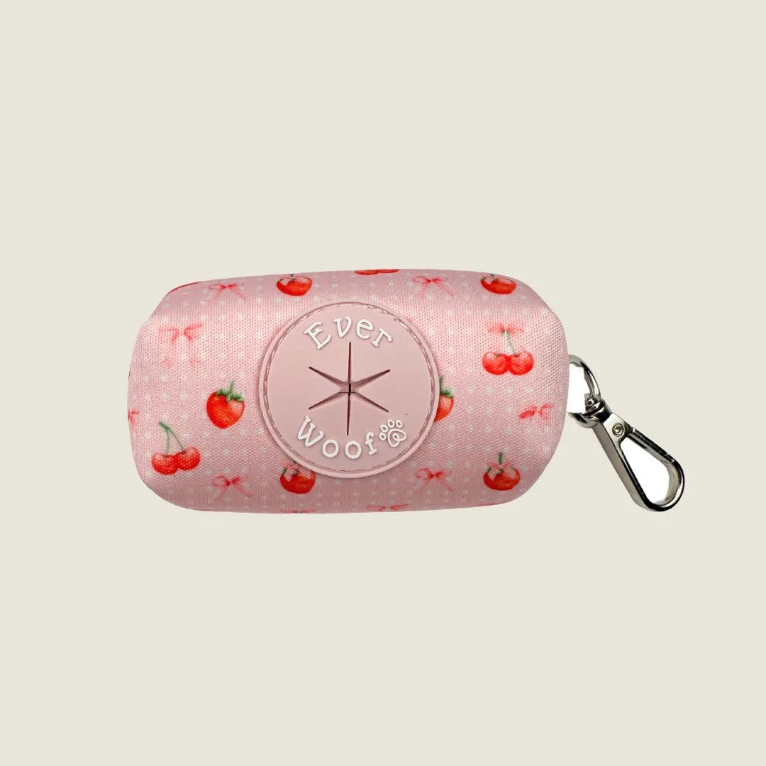 Pink waste bag holder with cherry pattern and a metal swivel hook by EverWoof. Ideal for dog walking and outings.