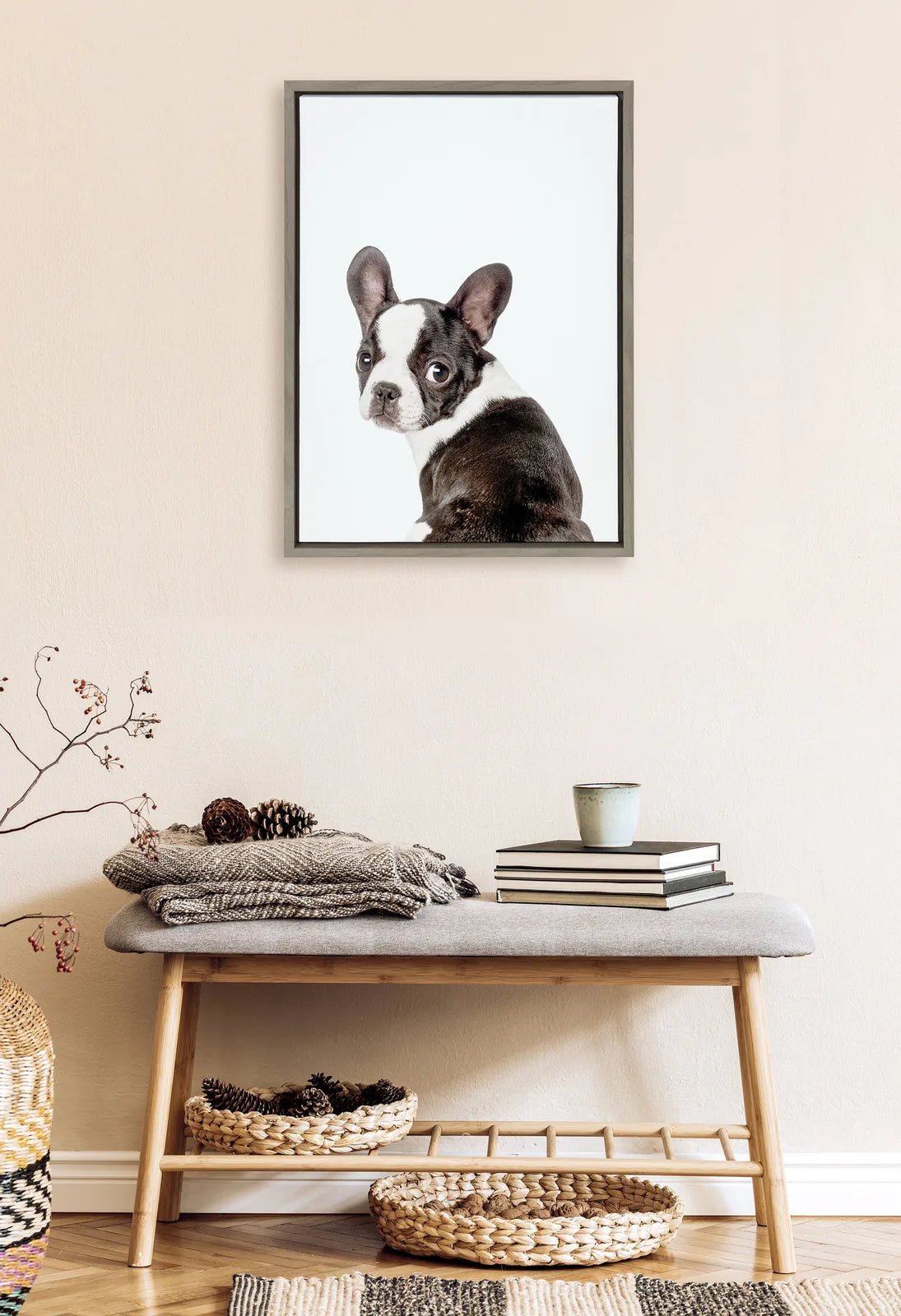 Framed canvas featuring a charming black and white French Bulldog illustration, displayed above a cozy bench.