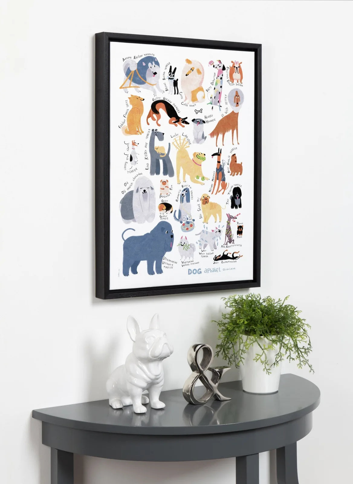 Framed canvas art featuring colorful dog breeds and playful lettering, set in a stylish woodgrain-like frame.