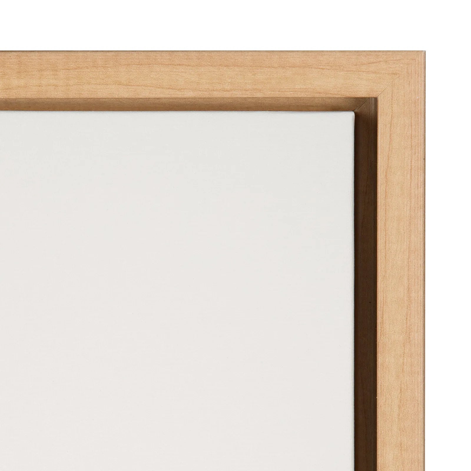 Framed canvas artwork showcasing a minimalist design with a natural wood frame and blank canvas surface.