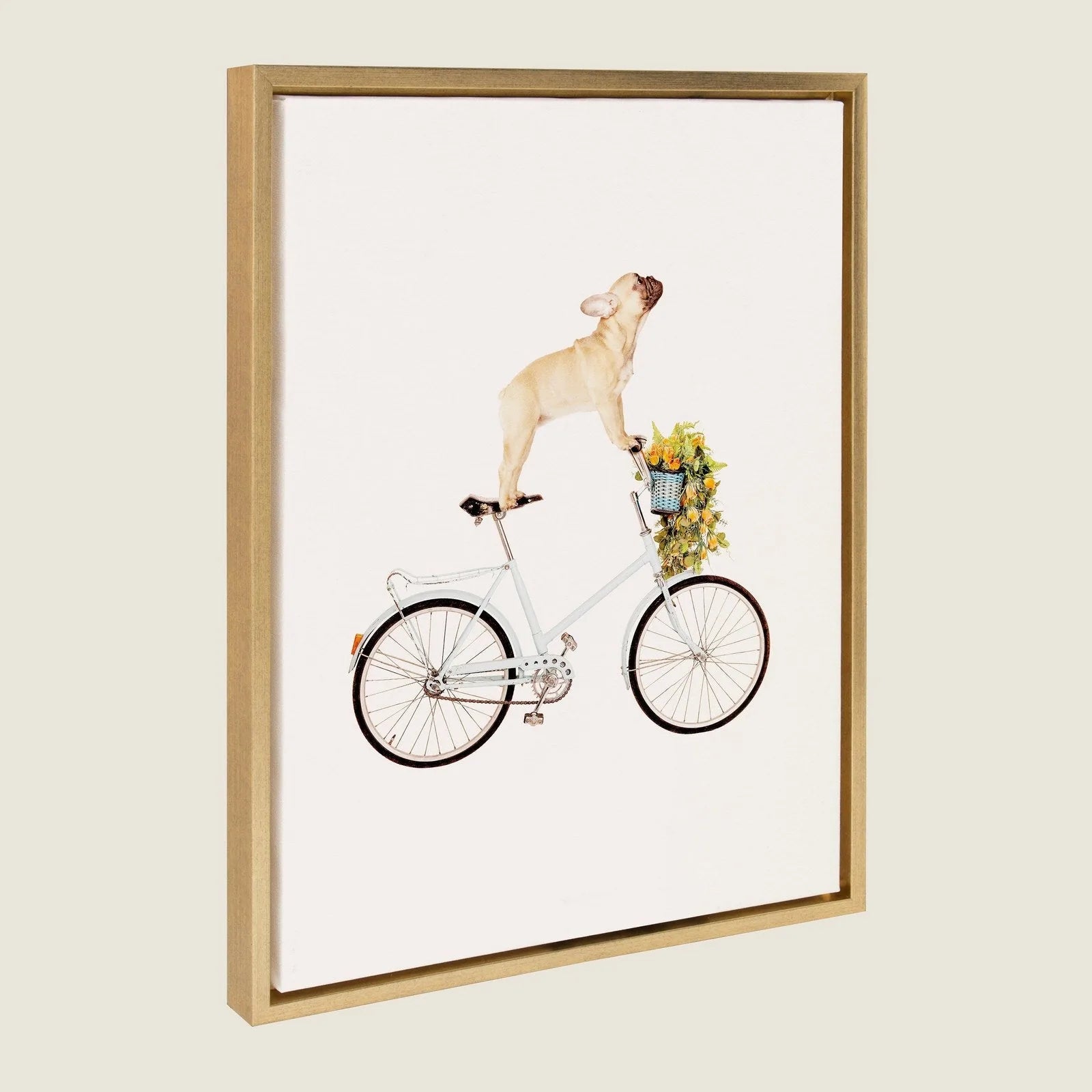 Framed canvas art featuring a playful French Bulldog balancing on a light blue bicycle, adorned with colorful flowers.