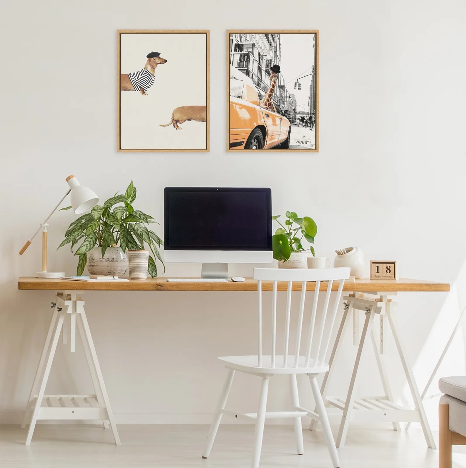 Framed canvas art featuring a long dog in a striped shirt, displayed in a modern office setting with a desk and plants.