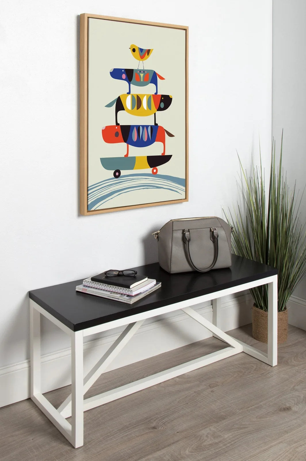 Framed canvas art featuring colorful dogs on skateboards by Rachel Lee, set in a modern decor arrangement.