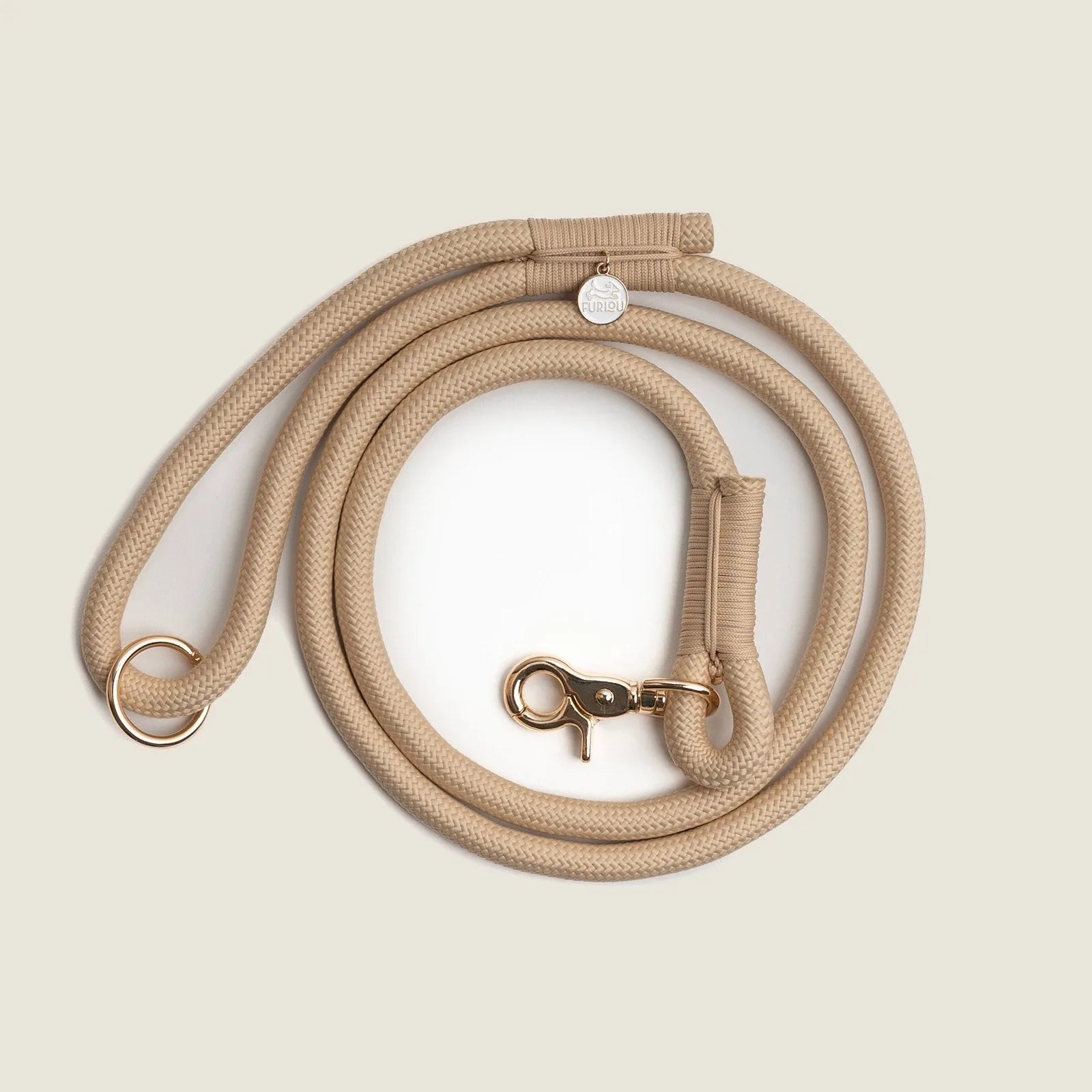 Tan braided rope leash by FURLOU, featuring durable nylon, reinforced stitching, and a gold-tone clip and O-ring.