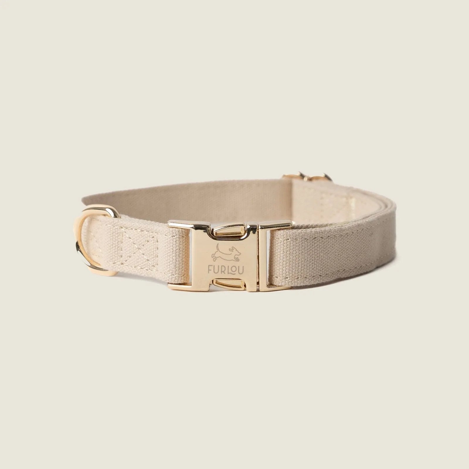 Tan canvas dog collar by FURLOU featuring gold hardware, designed for comfort and style.