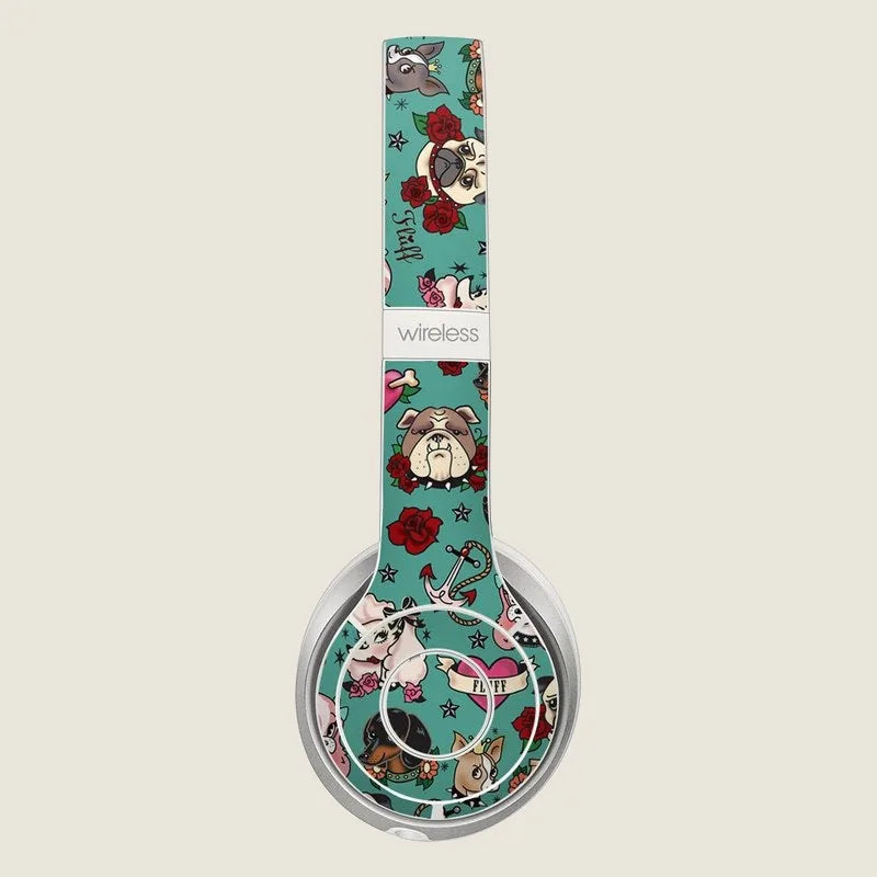 Tattoo Dogs design on turquoise Beats Solo 3 Wireless skin, featuring playful dog illustrations and rose accents.
