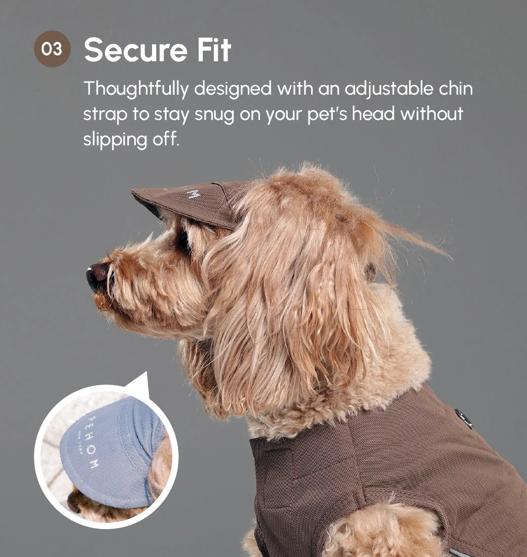 Brown tennis hat on a dog, featuring a secure adjustable chin strap and a reflective logo for visibility.