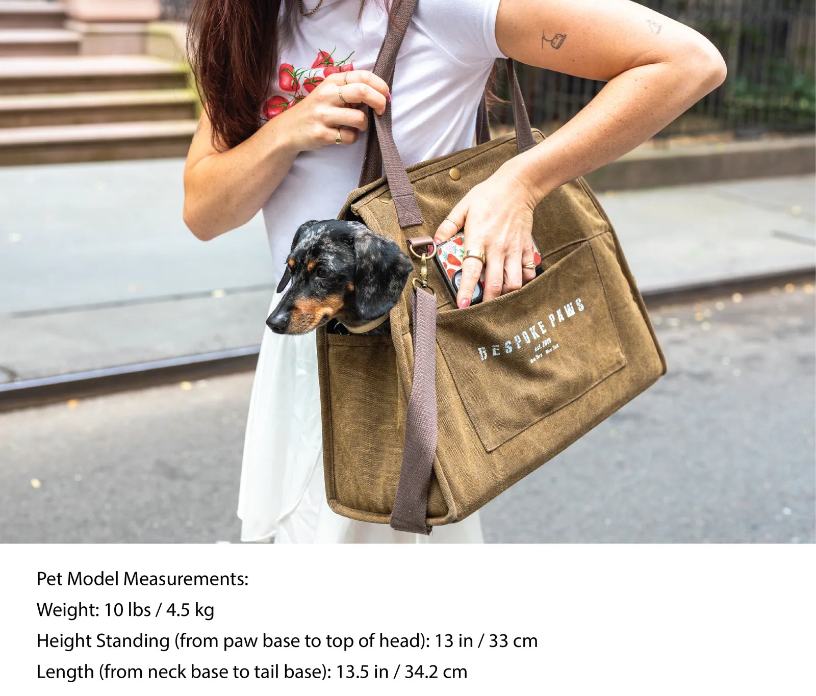 Stylish army green pet carrier from BESPOKE PAWS, featuring a dog peeking out and lightweight, durable design.