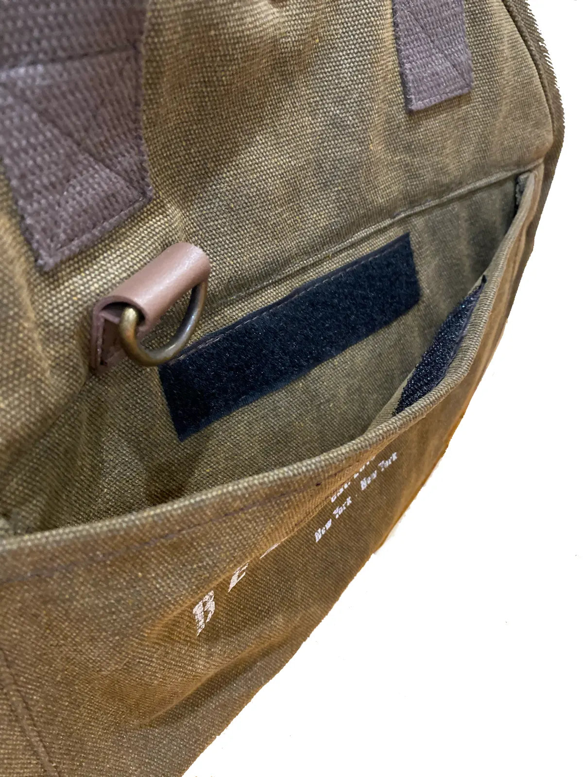 Inside view of The Daily Carrier in Army Green, showing pocket detail and recycled cotton canvas material.
