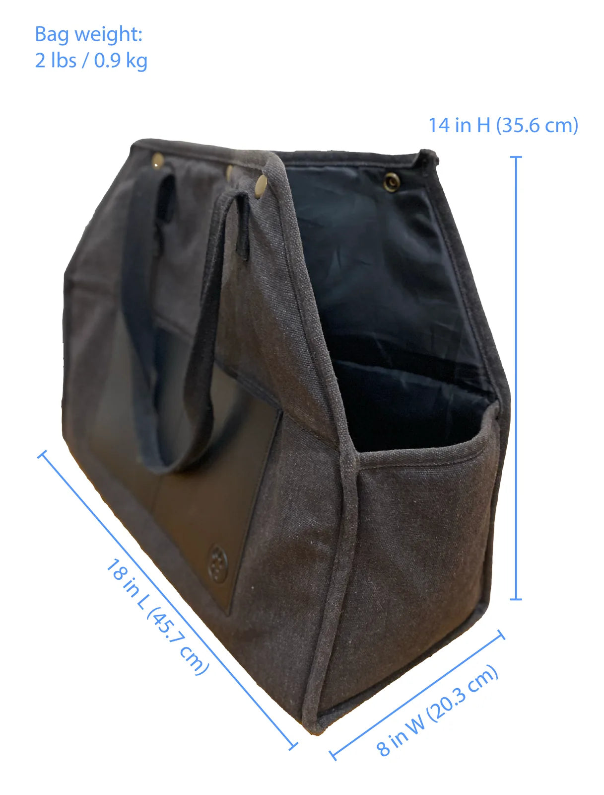 Packable luxury pet carrier in black recycled cotton canvas; lightweight with vegan leather trim, designed for urban travel.