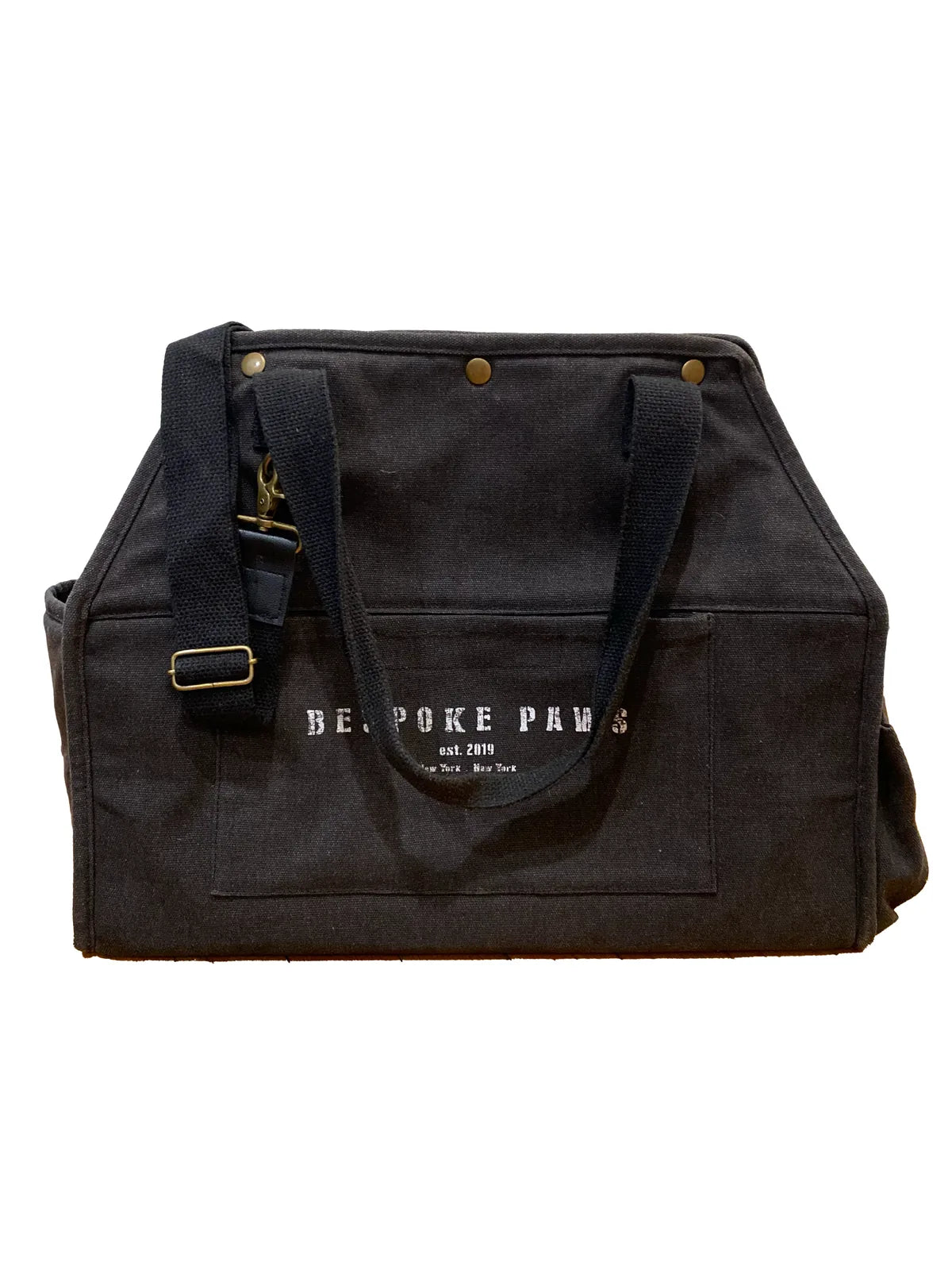 Stylish black pet carrier made from recycled cotton canvas, featuring vegan leather trim and gold accents.
