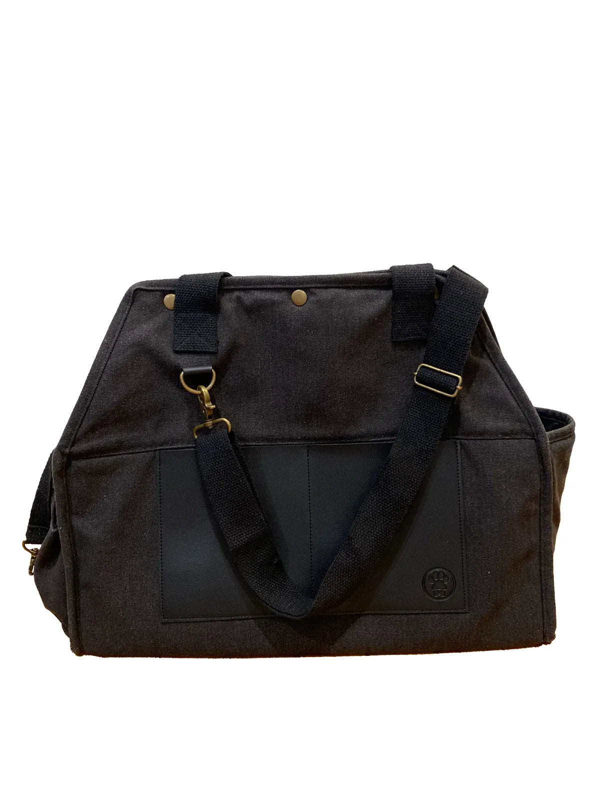 Stylish black pet carrier made from recycled cotton canvas with vegan leather trim, featuring sturdy shoulder straps.