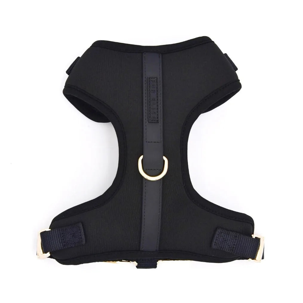 Breathable black neoprene dog harness featuring a gold D-ring and accents, designed for comfort and control during walks.
