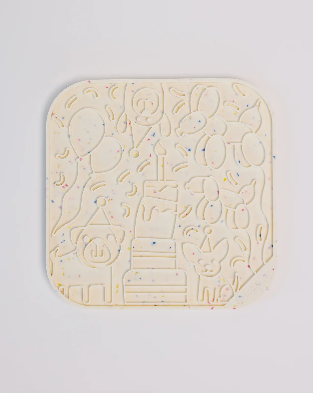 Colorful birthday-themed lick mat featuring a cake, balloons, and playful dog designs in food-grade silicone.
