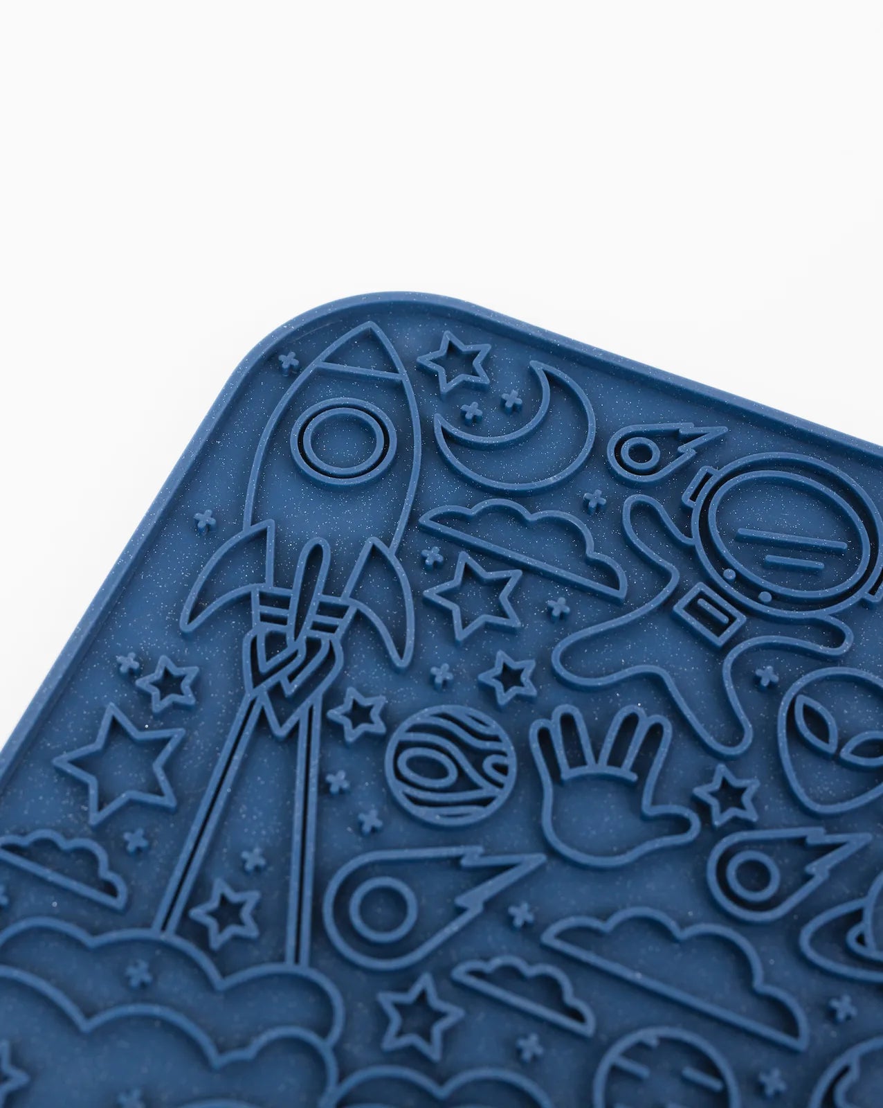 Galaxy-themed blue silicone lick mat featuring rockets, planets, and stars for interactive dog feeding.