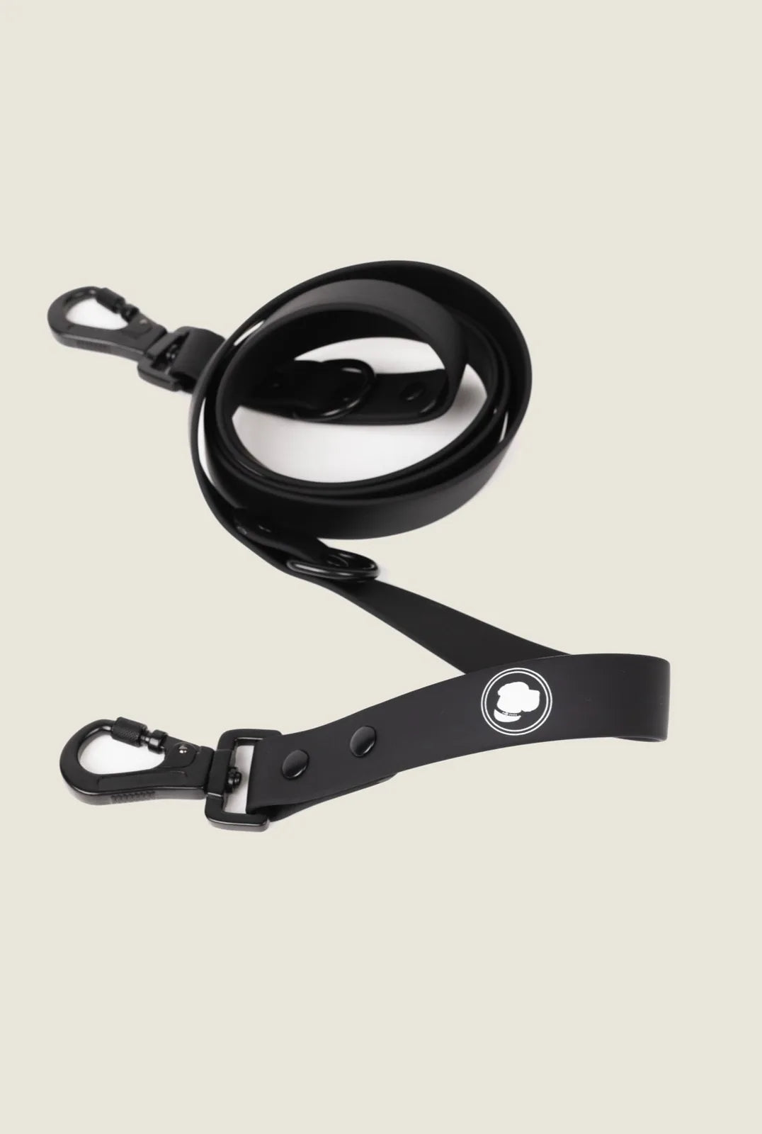 Black adjustable dog leash featuring a sleek design and sturdy attachments, suitable for all-weather use.