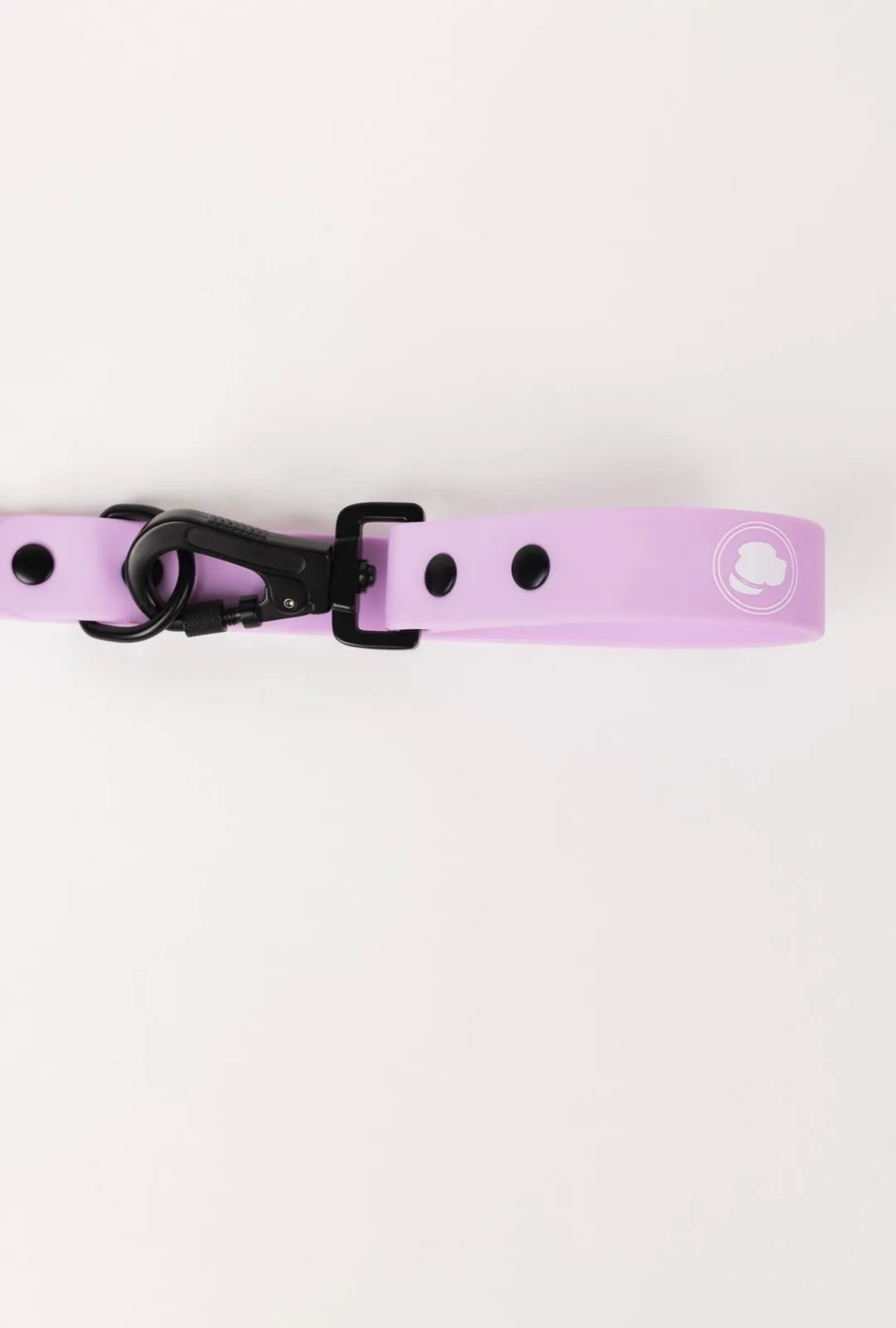 Blush pink adjustable dog leash with black hardware and logo, designed for all-weather walks and easy cleaning.