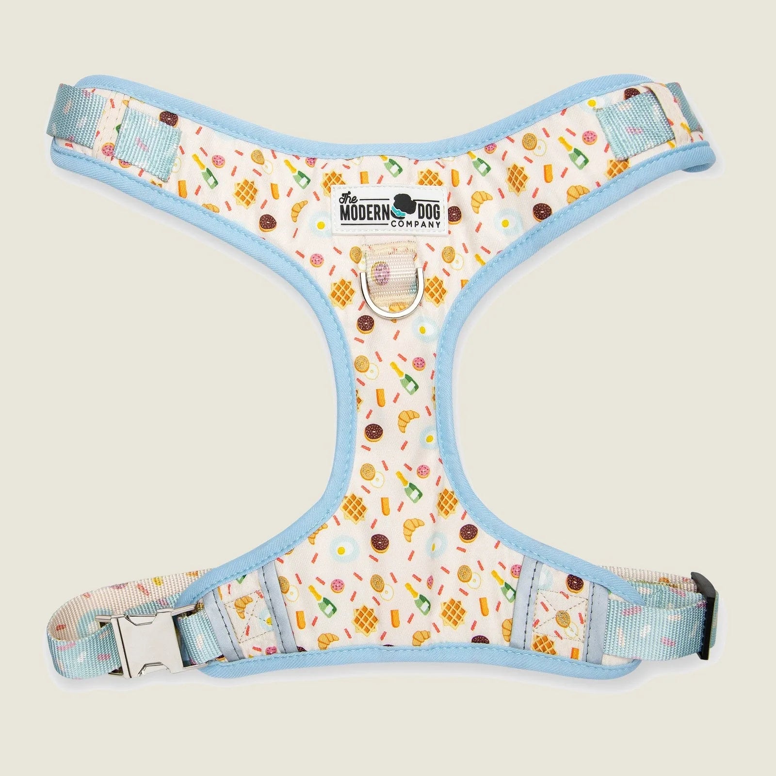Colorful dog harness featuring a playful brunch-themed design, adjustable straps, and double D-ring for leash attachment.