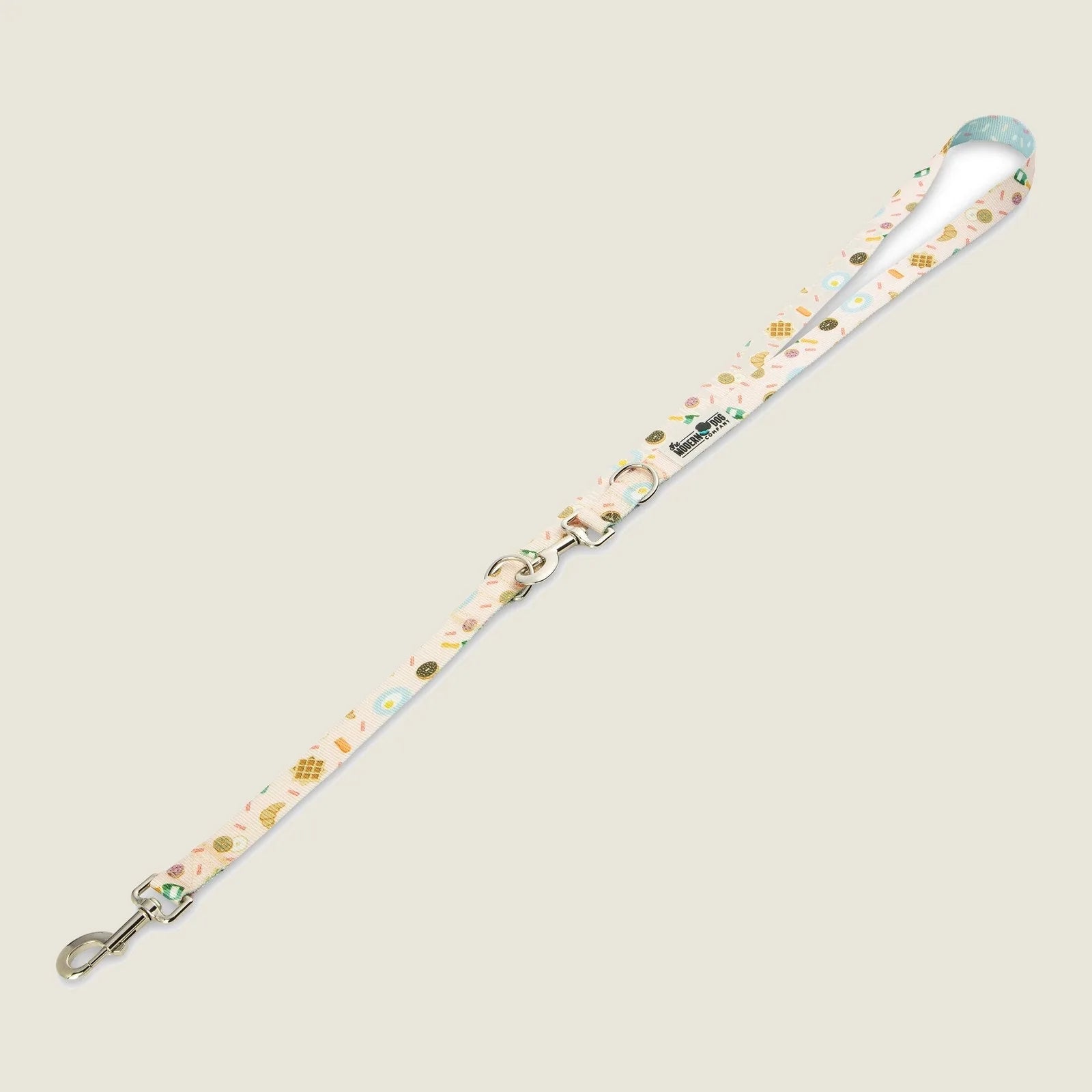 Stylish adjustable dog leash in pastel colors, featuring brunch-themed patterns and dual swivel bolts for length adjustments.