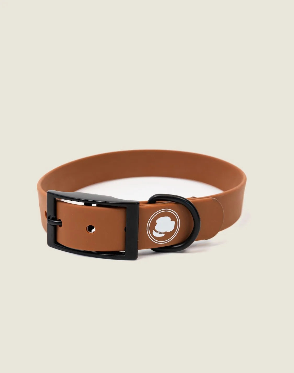 Coco brown adjustable dog collar with a black buckle and logo, designed for all-weather use.