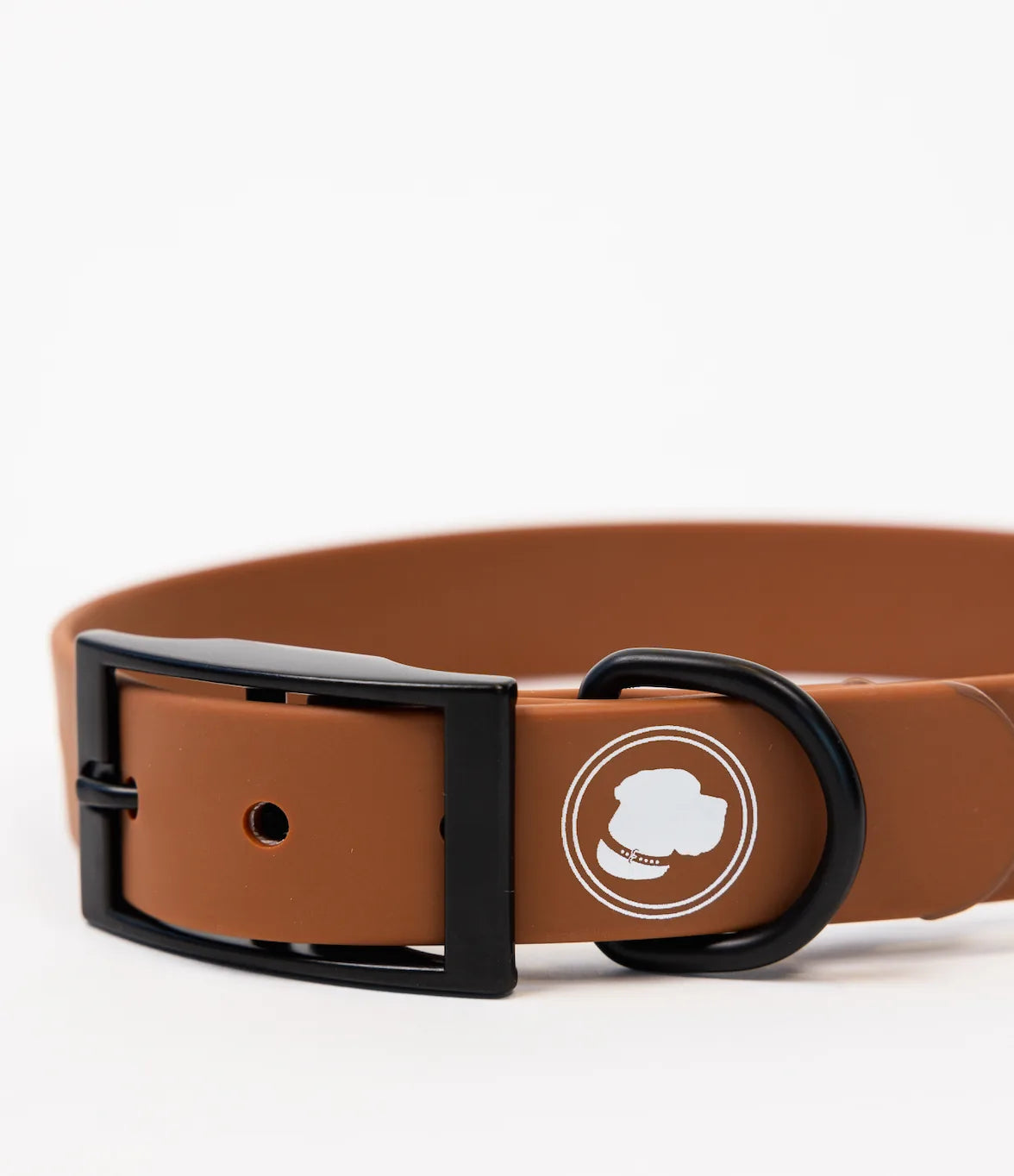 Coco brown adjustable dog collar with a black buckle and circular logo, suitable for outdoor adventures.
