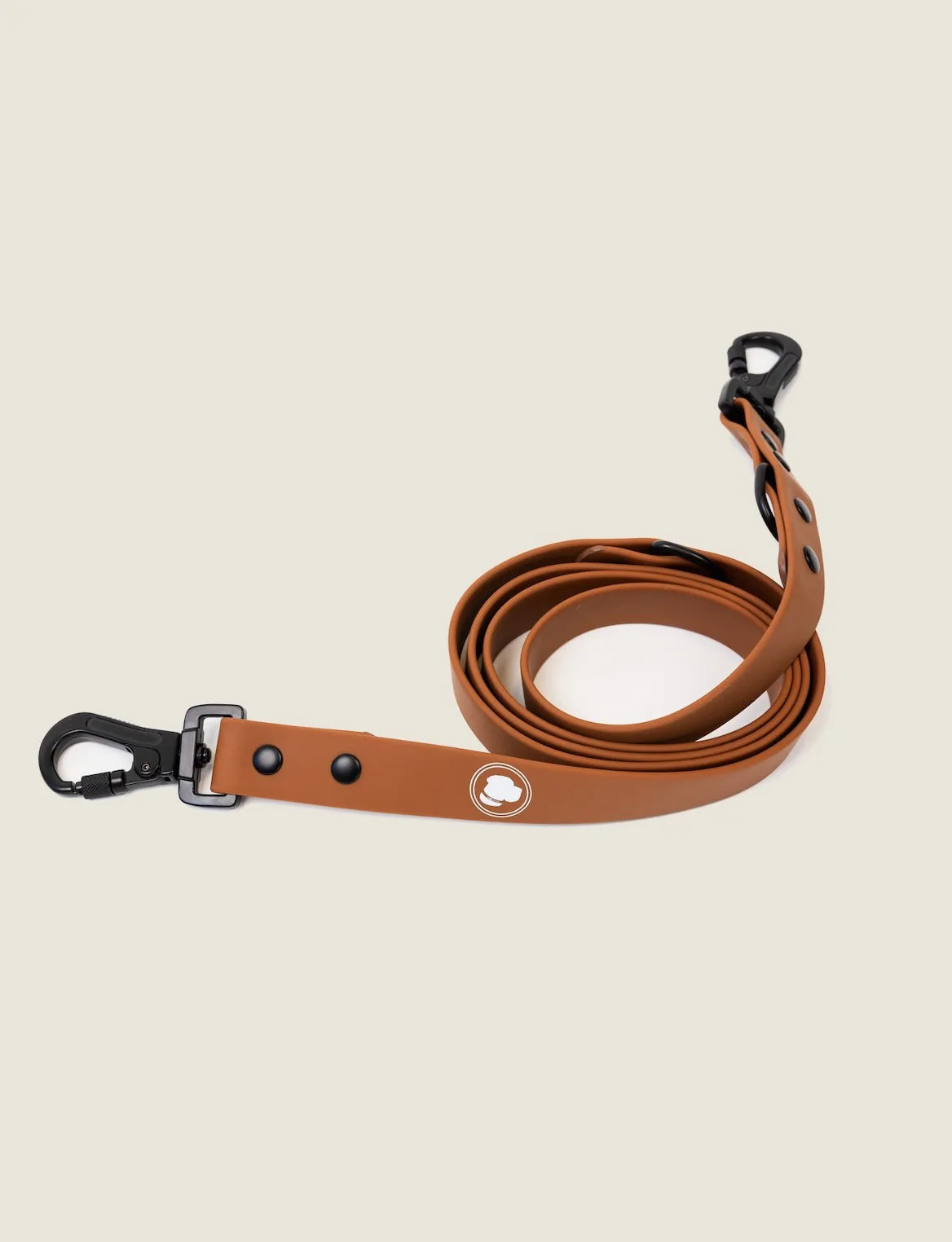 Coco Brown adjustable dog leash with black clips, featuring a smooth design and weather-resistant material.