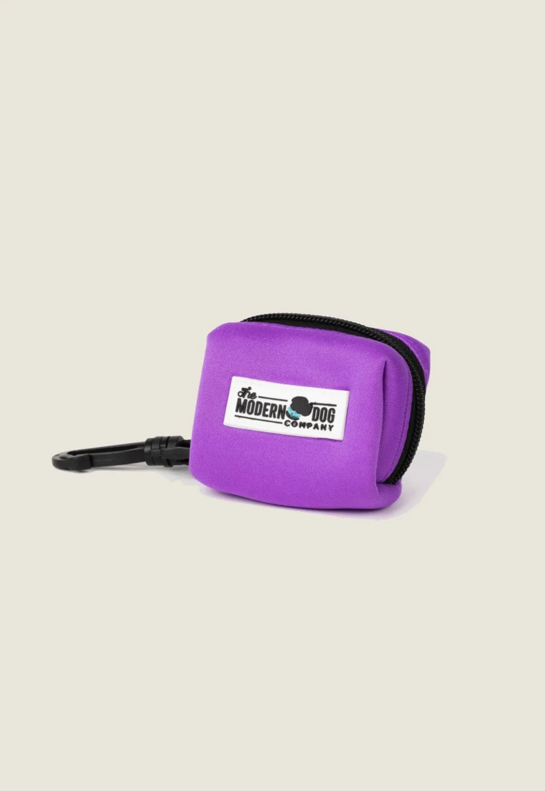 Electric fuchsia poop bag holder made of lightweight neoprene, featuring a clip for easy attachment to leashes.